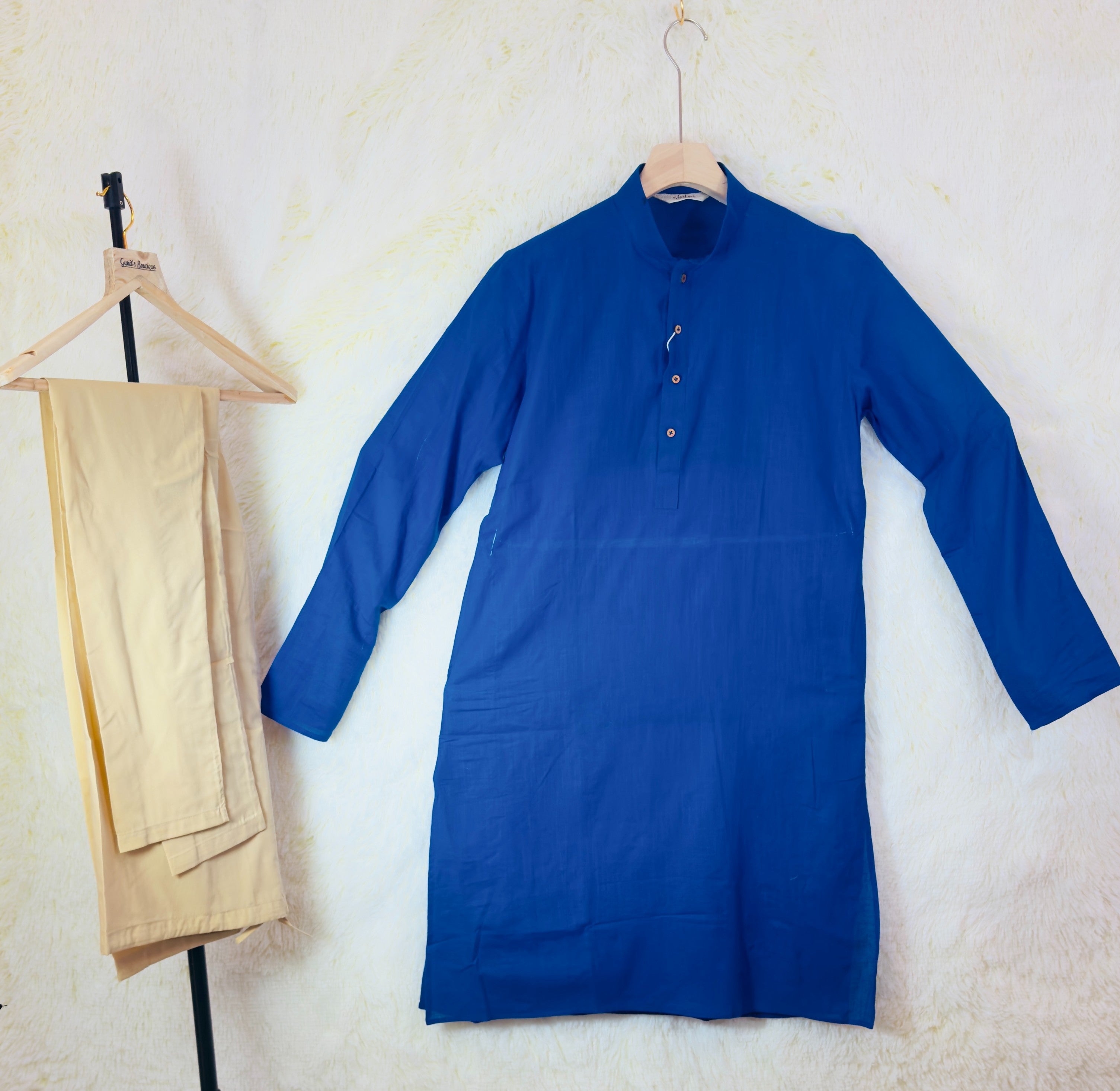 Royal blue kurta with mandarin collar and beige trousers