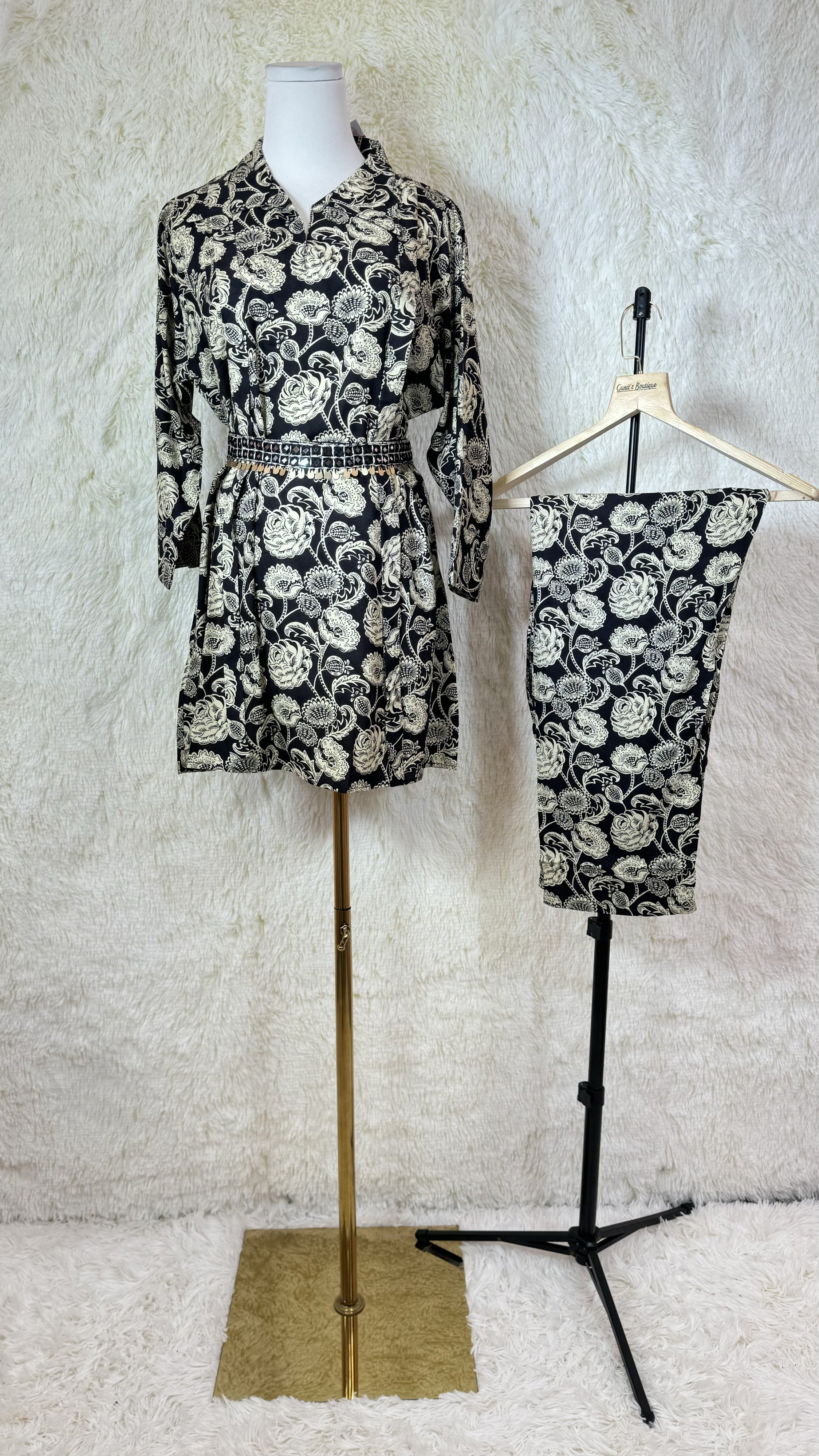 Black dress set with intricate floral embroidery, mandarin collar, and matching pants.
